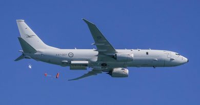 A Royal Australian Air Force P-8A Poseidon drops a life raft during training. Photo by Corporal Brendan Kwaterski.