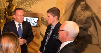Then Prime Minister Tony Abbott speaks to fellow visitors to The Spirit of Anzac Centenary Experience travelling exhibition in Wodonga. Photo by David McCleneghan.