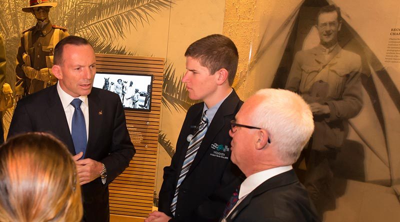 Then Prime Minister Tony Abbott speaks to fellow visitors to The Spirit of Anzac Centenary Experience travelling exhibition in Wodonga. Photo by David McCleneghan.