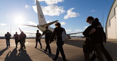 ACT Rural Fire Service firefighters board a RAAF Boeing Business Jet, on their way to help fight raging bushfires near Port Macquarie. Photo by Sergeant Ray Vance.