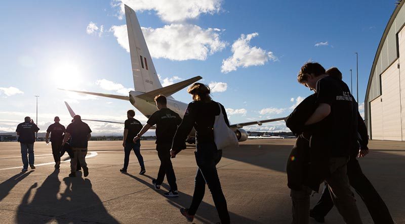 ACT Rural Fire Service firefighters board a RAAF Boeing Business Jet, on their way to help fight raging bushfires near Port Macquarie. Photo by Sergeant Ray Vance.