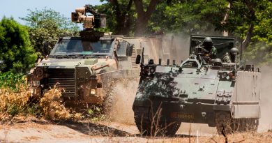 An Australian Army Bushmaster conducts tactical mounted manoeuvres with an M113/AS1 from the Tentara Nasional Indonesia Army (TNI-AD) at Dodiklatpur training base, East Java. Photo by Corporal Shane Kelly.