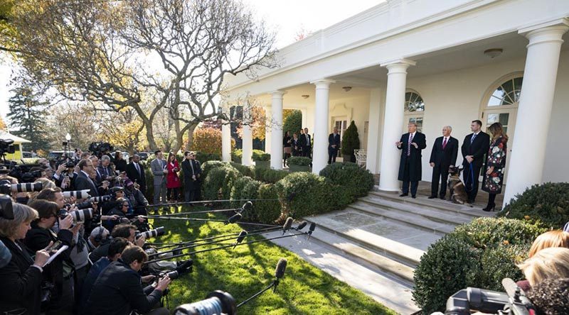 President Donald Trump, Vice President Mike Pence and First Lady Melania Trump present Conan to the media outside the White House, while the dog's special-forces handlers maintain their anonymity by staying in the Oval Office. White House photo.