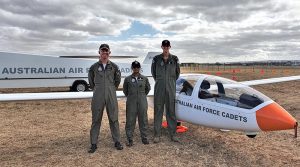 Glider pilot CUO Benjamin Dunk (No 613 Squadron) and aviation trainees CFSGT Tharane Thamodarar (No 604 Squadron) and CSGT Sean Fry (No 605 Squadron) with the AAFC DG-1000S glider operated by No 906 Aviation Training Squadron, at RAAF Edinburgh. Photo by Kerstin Hahn.