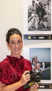 Winner, Katrina Glenn, with her prize and winning image (top). Photo by Leading Seaman Ernesto Sanchez.