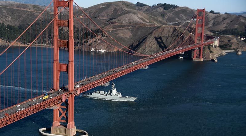 HMAS Brisbane under the Golden Gate Bridge during a port visit to San Francisco, California during her Combat System Qualification Trials.