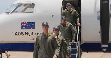 The last Royal Australian Navy's Laser Airborne Depth Sounder (LADS) flight crew exit their aircraft during the LADS Flight end of service ceremony at Cairns Airport, Queensland. Photo by Able Seaman Jarrod Mulvihill.