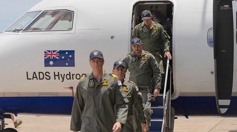 The last Royal Australian Navy's Laser Airborne Depth Sounder (LADS) flight crew exit their aircraft during the LADS Flight end of service ceremony at Cairns Airport, Queensland. Photo by Able Seaman Jarrod Mulvihill.
