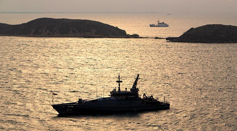 Royal Australian Navy Armidale-class patrol boat HMAS Larrakia at anchor in Port Moresby during APEC 2018. Photo by Chief Petty Officer Cameron Martin.