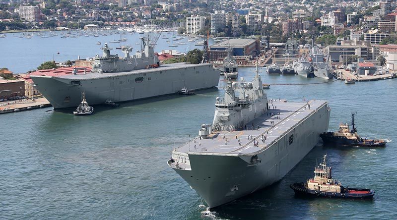 Landing helicopter dock ships Canberra (left) and Adelaide at Fleet Base East - Garden Island, Sydney. Photo by Petty Officer Kelvin Hockey.