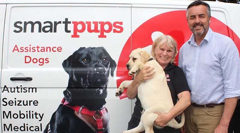 Founder and director of training with Smart Pups Patricia McAlister with Minister for Veterans and Defence Personnel Darren Chester. Supplied.