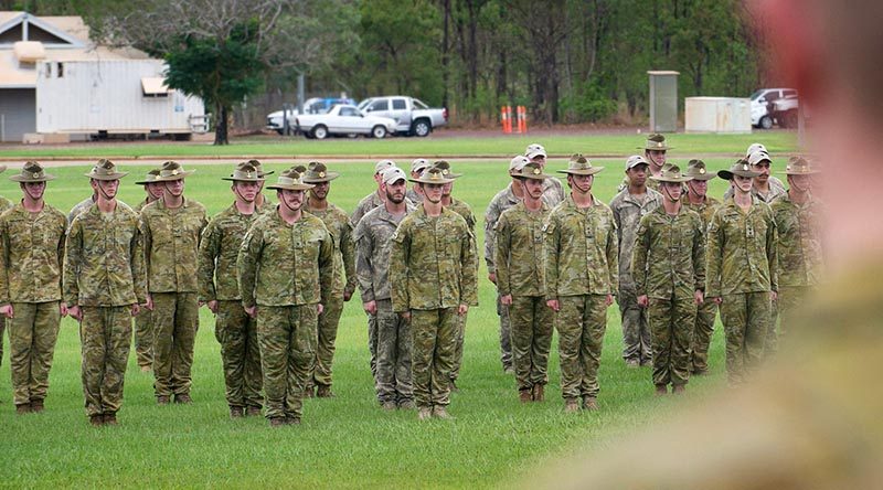 A reduced contingent of Australian and New Zealand soldiers and officers parade (in an apparently less-than-salubrious setting) during their official farewell from Robertson Barracks, Darwin, before deploying to the Middle East as part of Task Group Taji - Ten. Photo by Corporal Carla Armenti.