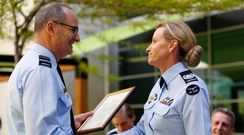 Chief of Air Force Air Marshal Mel Hupfeld congratulates Warrant Officer of the Air Force Fiona Grasby on her appointment as the ninth WOFF-AF, during a changeover ceremony at Russell Offices, Canberra. Photo by Corporal Veronica O'Hara.