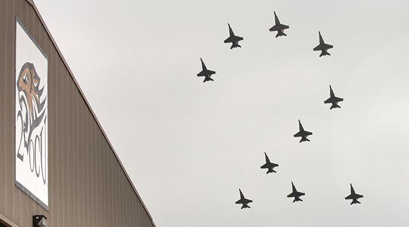 No. 2 Operational Conversion Unit conducts a formation flight, in the shape of a number 2 over their hangar at RAAF Base Williamtown. Two photos by Corporal Melina Young – digitally merged by CONTACT