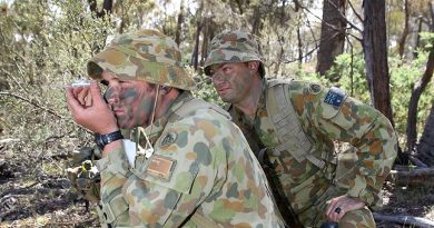 Staff Cadet Neil Fletcher shoots a compass bearing, supervised by Sergeant Wane Swan, at the Majura Training Area. Photo by Corporal Max Bree. Mid Cap: Sargent Wane Swan is an instructor of Third Class cadets at the Royal Military College, Duntroon. Third Class is the initial six months of training that teaches cadets basic soldier and section leadership skills.