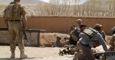 David Savage, right, lies injured on the ground after the blast that nearly killed him in the Chora Valley, Afghanistan, in 2012. Photo supplied by David Savage to the ABC.