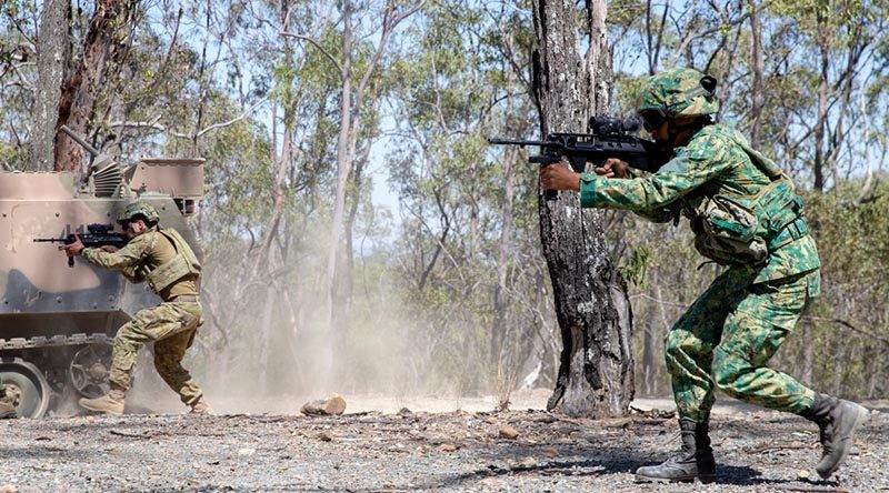 An Australian Army rifleman from Bravo Company 6RAR and a soldier from the Royal Brunei Land Forces take part in a section attack during Exercise Mallee Bull 2019, at Gallipoli Barracks, Queensland. Photo by Private Nicole Dorrett.