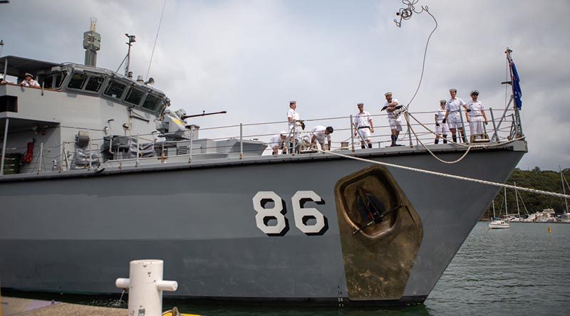 Royal Australian Navy sailors on HMAS Diamantina toss lines on approach to the wharf at HMAS Waterhen, Sydney. Photo by Able Seaman Thomas Sawtell.