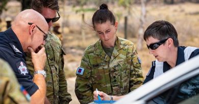 Lieutenant Matilda Connell and Corporal Trent Jones from the 3rd Combat Engineer Regiment conduct map reconnaissance with Deputy Incident Controller Emma Conway and Commander Mitch Simmons from the Country Fire Authority, to assess fire damage in Omeo, during Operation Bushfire Assist. Photo by Private Madhur Chitnis.