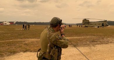 A 4 Squadron combat controller assists with the evacuation of civilians and the departure of Defence assets from Mallacoota airfield. Photo by Squadron Leader Chris Sharp.
