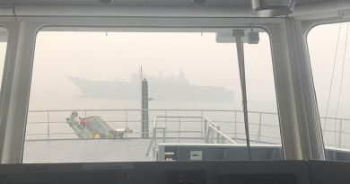 HMAS Adelaide as seen through the bridge window of MV Sycamore in Twofold Bay, New South Wales. Photo by Commander Brinckmann.