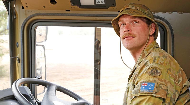 Australian Army soldier Private Jonathan Amey from the Brisbane-based 5 Transport Squadron, 7th Combat Services Support Battalion, in his HX77 heavy vehicle taking part in Operation Bushfire Assist. Photo by Sergeant Dave Morley.