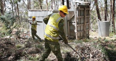 Private Ben Keogh uses a fire rake to clear vegetation away from the historic Bendora hut, located high in the Namadgi National Park in the ACT. Photo by Major Cameron Jamieson.