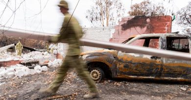 Soldier from the 12th/40th Royal Tasmanian Regiment clear debris from a home on Kangaroo Island that burnt down in the bushfires. Photo by Lance Corporal Brodie Cross.