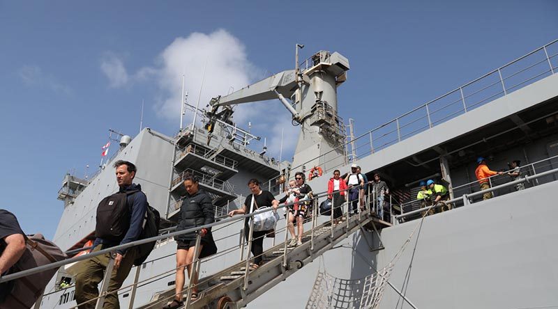 Evacuees from Mallacoota, Victoric, disembark HMAS Choules at Western Port. Photo by Petty Officer Nina Fogliani.