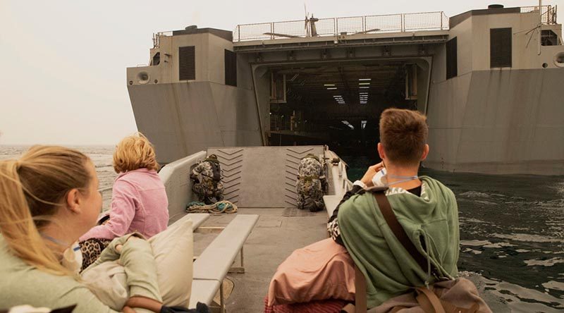 Evacuees from Mallacoota are transported to HMAS Choules. Photo by Petty Officer Helen Frank.