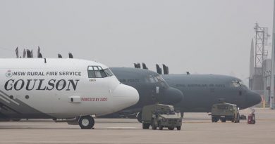 A NSW Rural Fire Service C-130 Hercules sits along side Royal Australian Air Force C-130J Hercules on the tarmac at RAAF Base Richmond during Operation Bushfire Assist 19-20. Photo by Sergeant Christopher Dickson.