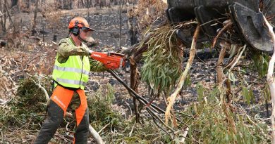 Lance Corporal Damien Ewin reduces bushfire-damaged trees to manageable pieces for disposal during road clearance operations near Ilford, NSW. Lance Corporal Ewin is an Australian Army Reserve engineer, from the 5th Engineer Regiment, – and also owner of Premier Defence Agencies and long-time advertising supporter of CONTACT. Photo by Major Cameron Jamieson