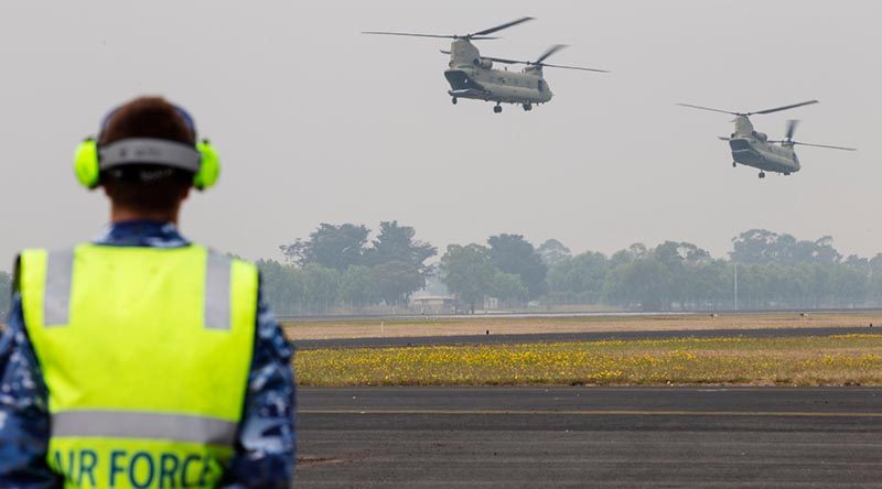 Two Australian Army CH-47F Chinooks filled with supplies for isolated areas in Victoria depart RAAF Base East Sale, which has become a key and very busy air-operations hub. Photo by Corporal Nicole Dorrett.