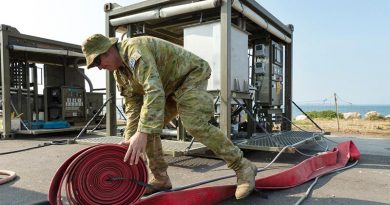 Corporal Luke Jackson from the 6th Engineer Support Regiment assembles an Australian Army mobile water filtration system at the Kingscote town jetty on Kangaroo Island. The mobile plant will turn sea water into drinking water for residents of the island. Photo by Corporal Tristan Kennedy.
