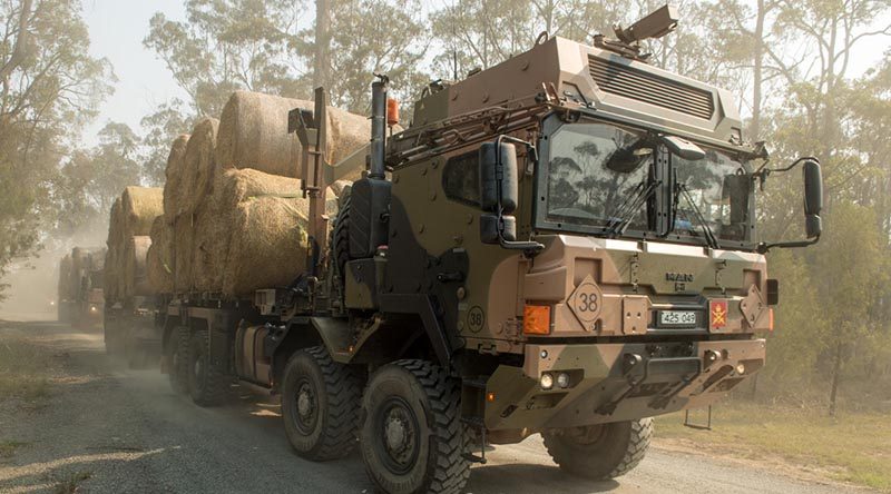 Australian Army HX77 heavy rigid trucks loaded with fodder heading for Bonang in the north of Gippsland on Australia Day in support of Operation Bushfire Assist. Photo by Private Michael Currie.