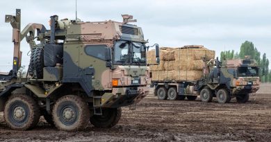 Australian Army HX77 heavy rigid vehicles load up with fodder near Cooma, NSW, for delivery to fire-affected farms. Photo by Sergeant Brett Sherriff.