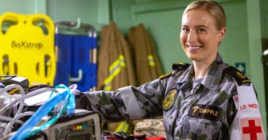 Leading Seaman Medic (Underwater) Kiah Chapple prepares medical equipment in the flight deck triage onboard HMAS Adelaide. Photo by Able Seaman Thomas Sawtell.