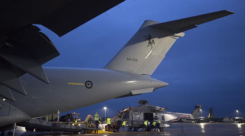 A Royal New Zealand Air Force NH-90 is unloaded off a Royal Australian Air Force C-17A Globemaster III aircraft at RAAF Base Richmond during Operation Bushfire Assist 19-20. Photo by Corporal Nicci Freeman.