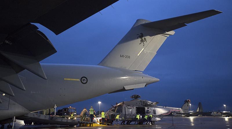 A Royal New Zealand Air Force NH-90 is unloaded off a Royal Australian Air Force C-17A Globemaster III aircraft at RAAF Base Richmond during Operation Bushfire Assist 19-20. Photo by Corporal Nicci Freeman.