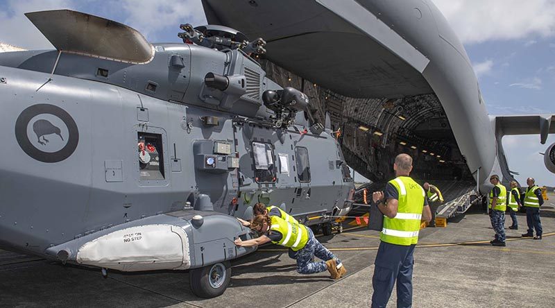 A RNZAF No.3 SQN NH90 helicopter is loaded onto a RAAF C-17, on its way to assist with the Australian bushfires. NZDF photo.