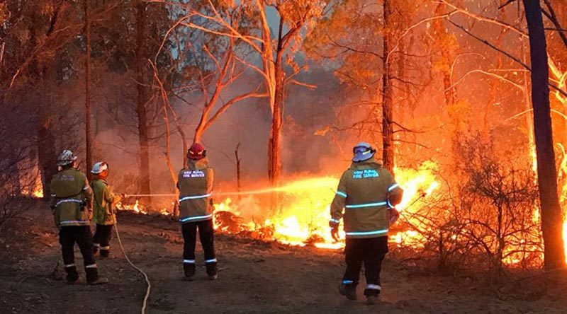 Lieutenant Matt Urquhart from HMAS Albatross fights a fire on the New South Wales south coast as a member of the NSW Rural Fire Service, during the 2019-20 Australian bushfire crisis.