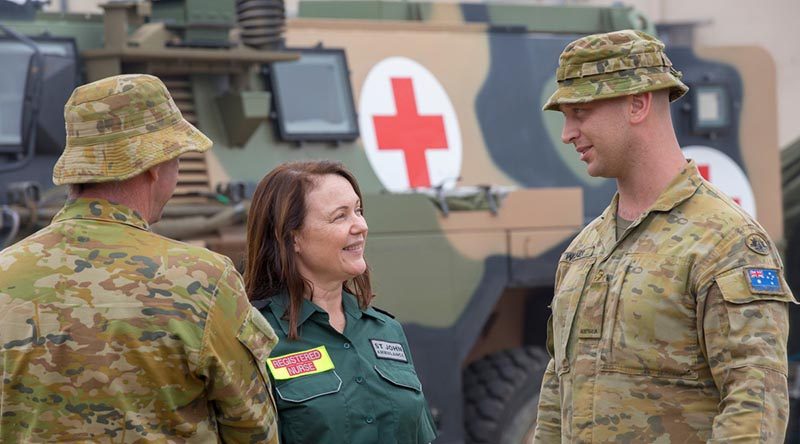 St John Ambulance Registered Nurse Diana Wong chats with Australian Army medic Private Brenden Walker from the 1st Combat Health Battalion at Batemans Bay. Photo by Sergeant Bill Solomou.