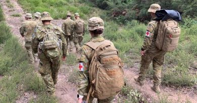 Australian Army soldiers from the 7th Battalion, Royal Australian Regiment, move on foot into the isolated community of Gipsy Point, north-west of Mallacoota, Victoria, to provide health support. Photo by Major Gavin Cole.