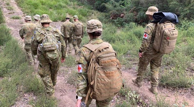 Australian Army soldiers from the 7th Battalion, Royal Australian Regiment, move on foot into the isolated community of Gipsy Point, north-west of Mallacoota, Victoria, to provide health support. Photo by Major Gavin Cole.