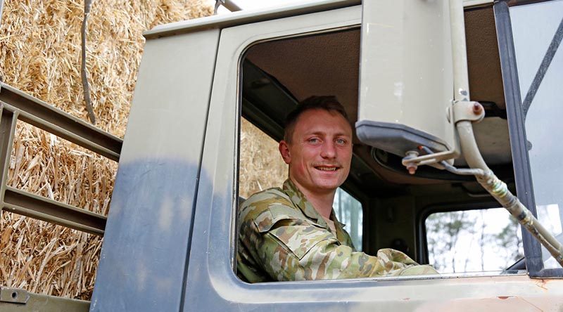 Australian Army Reserve soldier Private Jonathan Catt, a Unimog truck driver with 16 Transport Squadron, 8th Combat Services Support Battalion, from Newcastle, delivering fodder to farmers during Operation Bushfire Assist 19-20. Photo by Sergeant Dave Morley.