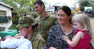 Corporal Kristie Connell, of the 8th Combat Service Support Battalion, and Private Nicholas Brimmer, of the 2nd/17th Battalion, Royal New South Wales Regiment, with Sarah and Ruby Tyrrell and baby Ivy. Photo by Sergeant Max Bree.