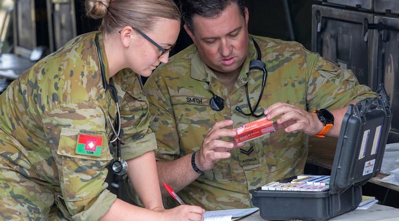 Australian Army nursing officer Lieutenant Alison Stock and medic Corporal Leigh Smith from 1st Combat Health Battalion conduct daily medication checks at Batemans Bay evacuation centre during Operation Bushfire Assist 19-20. Photo by Sergeant Bill Solomou.