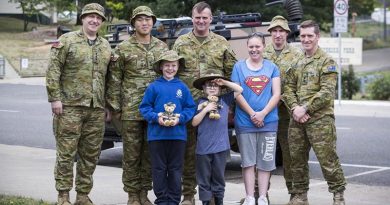 Chaplain Phil Linden, Lieutenant Henry Vong, Sergeant Glenn Ludeman, Warrant Officer Class One Anthony Jones and Lieutenant Colonel Daniel Strack with Omeo locals Jackson, Ryan and Rebecca, back home in Omeo. Photo by Corporal Sebasitan Beurich.