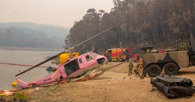 An Australian Army Heavy Recovery Vehicle is used to recover a NSW Rural Fire Service-contracted helicopter that ditched in the Ben Boyd Reservoir near Eden, NSW. Photo: Sergeant Bill Solomou.