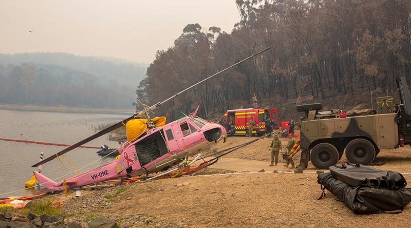 An Australian Army Heavy Recovery Vehicle is used to recover a NSW Rural Fire Service-contracted helicopter that ditched in the Ben Boyd Reservoir near Eden, NSW. Photo: Sergeant Bill Solomou.